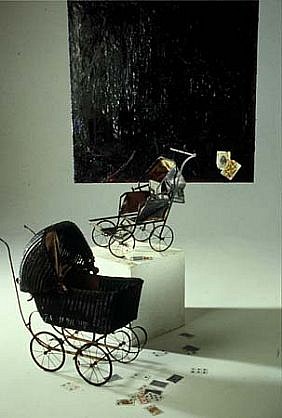 Willie Little
Black Jack (Installation), 2002
oil, wax, antique pram, cards, 48 x 48 inches