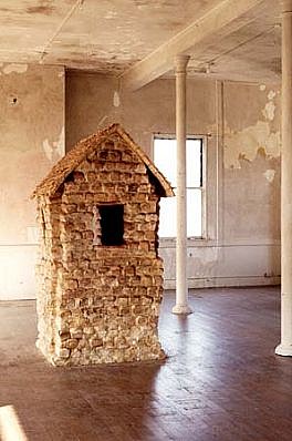 Sheila Ghidini
Dwelling, 1993
constructed of loaves of bread, 30' x 10' x 12'
Installation