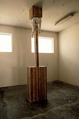 Edward Giordano Jr.
1996
plaster, wood, man, cube, ceiling, 12' H.Cube 20" x 20"Base: 48" H x 48" D x 24"