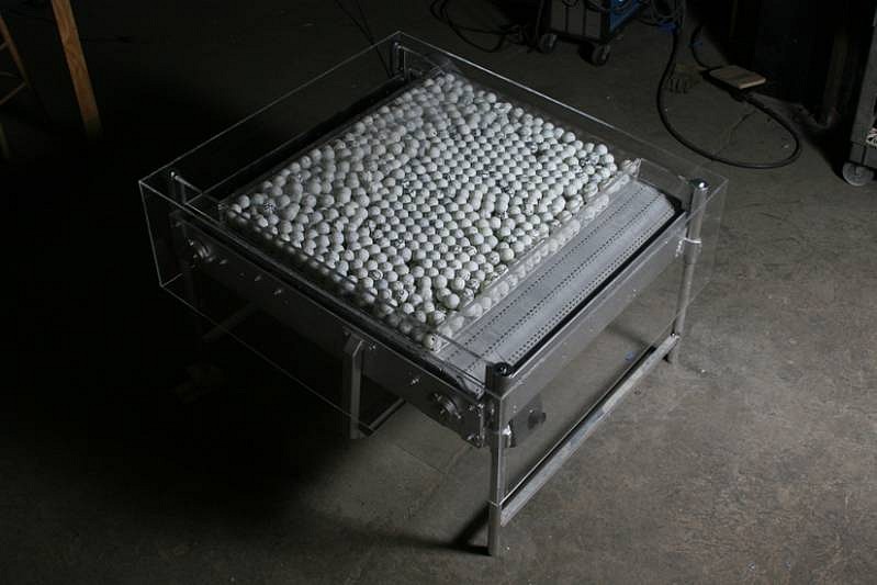 Barbara Cohen
Moving On, 2007-10
motorized conveyor belt, metal base, graphite drawn on ping pong, 48 x 48 x 36 inches