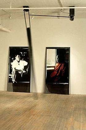 Linda Covit
Traces - detail, photos and pendulum movement, 1991
steel, wood, paint, plastic, b&w and colour photos, motor, 10 x 16 x 70 feet