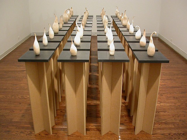 Kyoung Ae Cho
Standing Alone, 2003
burn marks on wood, 40 pieces, ranging from 5.5 to 12 inches