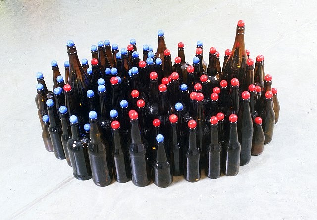 Tony Feher
Red into Blue, 2004
approx. 104 blown glass bottles, 52 blue opaque marbles, and 52 red opaque marbles, 18 x 35 x 15 in.
