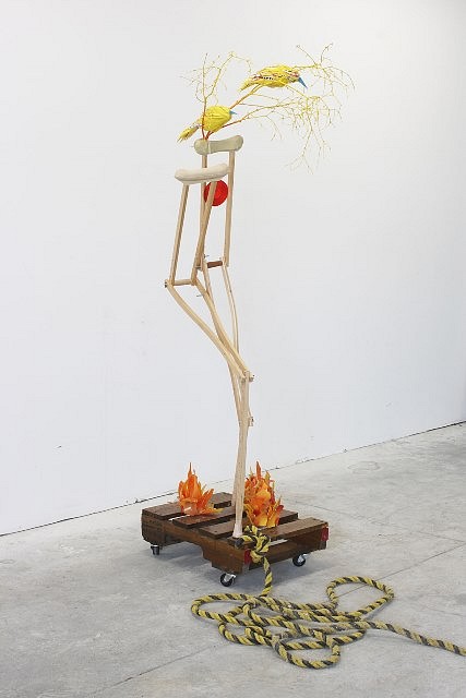 Rachel Owens
Self-portrait, 2008
crutches, palette, wheels, rope, branches, glass, plastic, reflector, 81 x 26 x 24 in.