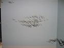 Katerina Wong, ...like clouds
2004, wax casts of fingerprints, sumi ink, powdered graphite on painted wall