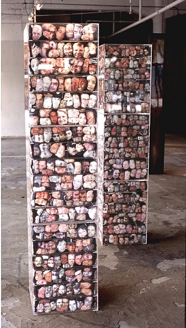 Elia Alba
Multiplicities, 2002
plexiglass, photocopy transfer over muslin and thread composed of 1800 unique heads, each tower- 78 x 18 x 18 inches
