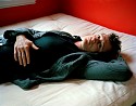 Jess T. Dugan, Dallas lying on the bed
2012, archival pigment print