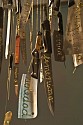 Catalina Mena, Domestic Lexicon (detail)
2012, different kinds of used kitchen knives hand-embroidered with gold thread suspended from the ceiling by the  same gold thread and metal nails