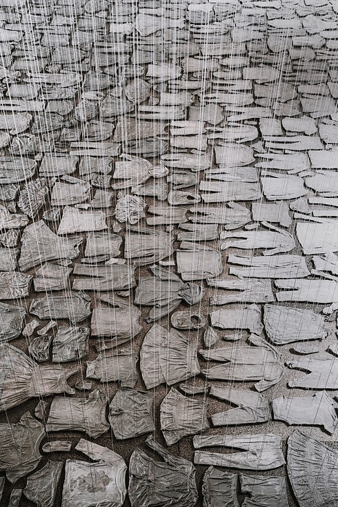 Beili Liu
Each and Every (detail) (installation, with performance), 2019
Children’s clothing, cement, cotton thread, table, chair, scissors, needle, 23 x 27 x 25 in.