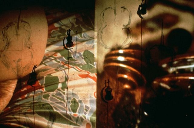 Carolee Schneemann
Cycladic Imprints (Detail), 1991 - 1993
17 motorized violins, 360 slides, 2 dissolve units, 4 projectors, 240 x 432 in.