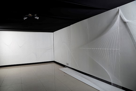 Parul Gupta
Notes on Movement Site Specific Drawing in Space #2, 2016
thread, needles, nails, permanent marker, glue on wall and two lights on kinetic structure on the ceiling, approximately 60 feet x 8 foot wall size